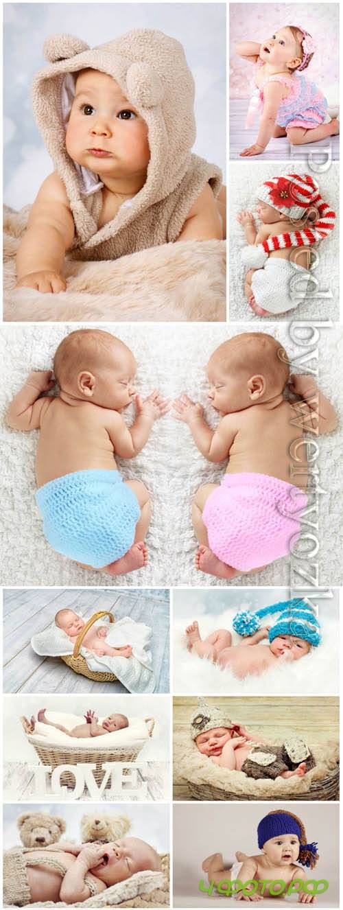 Newborn babies posing in studio stock photo