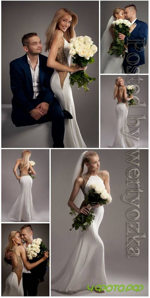 Bride and groom posing in studio stock photo